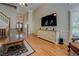 Bright living room showcasing hardwood floors, large windows, and comfortable seating at 1391 Sutters Dr, Lawrenceville, GA 30045