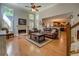 Spacious living room with hardwood floors, a fireplace, and abundant natural light at 1391 Sutters Dr, Lawrenceville, GA 30045