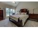 Cozy main bedroom with large window, vaulted ceiling, and comfortable furnishings at 1391 Sutters Dr, Lawrenceville, GA 30045