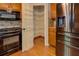 Kitchen features a walk-in pantry with ample storage and stainless steel appliances at 1391 Sutters Dr, Lawrenceville, GA 30045