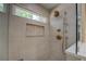 Shower featuring modern bronze fixtures, bench, and a window with natural light at 1391 Sutters Dr, Lawrenceville, GA 30045