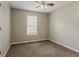 This carpeted bedroom is filled with light from the large window at 441 Amy Blvd, Temple, GA 30179