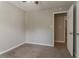 Carpeted bedroom with neutral paint offers an open closet at 441 Amy Blvd, Temple, GA 30179