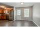 Bright dining area with wood-look floors, updated appliances, and natural light at 441 Amy Blvd, Temple, GA 30179