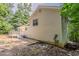 Exterior view of a home with vinyl siding, small deck and a gravel area at 441 Amy Blvd, Temple, GA 30179