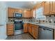 Modern kitchen with stainless steel appliances, granite countertops, and stylish backsplash at 441 Amy Blvd, Temple, GA 30179