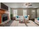 Cozy living room with a fireplace, neutral decor, and plenty of natural light at 441 Amy Blvd, Temple, GA 30179