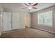 Spacious main bedroom with a ceiling fan and access to the main bath at 441 Amy Blvd, Temple, GA 30179