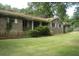 Traditional brick ranch with a well-maintained lawn at 6290 S Skyline Dr, Douglasville, GA 30135