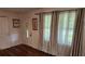 Foyer with rich hard wood floors and elegant door with side windows at 6290 S Skyline Dr, Douglasville, GA 30135