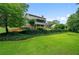 Spacious backyard showcasing lush green lawn and mature trees, offering a private and serene outdoor retreat at 9060 Par Dr, Douglasville, GA 30134