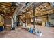 Unfinished basement space with exposed ceiling and ductwork, offering potential for customization and additional storage at 9060 Par Dr, Douglasville, GA 30134