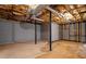 Unfinished basement with concrete floor and block wall, providing a blank canvas for future renovation projects at 9060 Par Dr, Douglasville, GA 30134