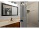 Bathroom vanity with an oval sink and an open door to a walk-in closet at 9060 Par Dr, Douglasville, GA 30134