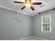 Nice bedroom featuring a ceiling fan, a window with blinds and neutral walls at 9060 Par Dr, Douglasville, GA 30134