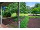 Beautifully landscaped front yard with lush greenery, manicured pathways, and mature trees at 9060 Par Dr, Douglasville, GA 30134