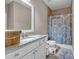 Bathroom featuring granite countertops, stylish fixtures, and a tiled shower at 1120 Cordia Nw Ave, Atlanta, GA 30318