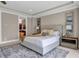 Comfortable bedroom featuring a plush bed, nightstands, and views to the en-suite bathroom at 1120 Cordia Nw Ave, Atlanta, GA 30318