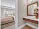 Bedroom view highlights hardwood floors, natural light, and ensuite bathroom at 1120 Cordia Nw Ave, Atlanta, GA 30318