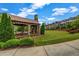 Inviting outdoor community space with stone fireplace, covered seating, and manicured lawn offers a relaxing gathering spot at 1120 Cordia Nw Ave, Atlanta, GA 30318