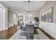 Elegant dining room featuring a glass-top table, plush upholstered chairs, and stylish wainscoting at 1120 Cordia Nw Ave, Atlanta, GA 30318