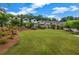 Spacious community green space with manicured lawn and mature trees, ideal for outdoor activities and relaxation at 1120 Cordia Nw Ave, Atlanta, GA 30318