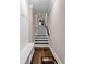 Hallway with bench and coat hooks leading to a staircase with hardwood floors at 1120 Cordia Nw Ave, Atlanta, GA 30318