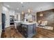 Open-concept kitchen featuring a large island, stainless steel appliances and dining space at 1120 Cordia Nw Ave, Atlanta, GA 30318