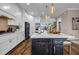 Contemporary kitchen boasting a large island, stainless steel appliances, and white cabinetry at 1120 Cordia Nw Ave, Atlanta, GA 30318