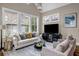 This living room features large windows, a neutral color palette, and plush seating at 1120 Cordia Nw Ave, Atlanta, GA 30318
