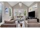 Bright living room boasts vaulted ceilings, neutral colors, and large windows at 1120 Cordia Nw Ave, Atlanta, GA 30318