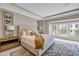 Well-lit main bedroom featuring a king-size bed, windows, and decorative lamps at 1120 Cordia Nw Ave, Atlanta, GA 30318