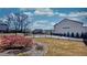 Backyard features black fencing and blossoming azalea bushes at 3173 Rockbridge Rd, Avondale Estates, GA 30002