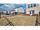 Backyard with black fencing and view of the home's screened in porch at 3173 Rockbridge Rd, Avondale Estates, GA 30002
