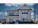 Beautiful two-story home with stone accents and a covered front porch offers curb appeal and charm at 3173 Rockbridge Rd, Avondale Estates, GA 30002