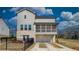 Two-story home featuring a white-painted garage, an attached screened in porch and brick accents at 3173 Rockbridge Rd, Avondale Estates, GA 30002