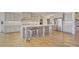 Gourmet kitchen features an oversized island, stainless appliances, and a convenient breakfast bar at 3173 Rockbridge Rd, Avondale Estates, GA 30002