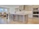 Stylish kitchen boasts a large island, stainless appliances, and a dedicated dining space at 3173 Rockbridge Rd, Avondale Estates, GA 30002