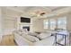 Cozy living room featuring a fireplace, built-in shelving, and large windows for natural light at 3173 Rockbridge Rd, Avondale Estates, GA 30002