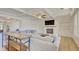 Bright living area with a fireplace, built-in shelving and modern coffered ceiling, connecting to a sofa at 3173 Rockbridge Rd, Avondale Estates, GA 30002