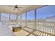 Relaxing screened-in porch featuring a ceiling fan and comfortable seating area at 3173 Rockbridge Rd, Avondale Estates, GA 30002