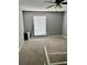 Comfortable bedroom space featuring carpet flooring and a window with blinds at 3298 Abbeywood Dr, Decatur, GA 30034