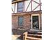 Charming townhome featuring brick facade, secure barred windows, and inviting front entrance at 3298 Abbeywood Dr, Decatur, GA 30034