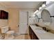 Bathroom featuring double sinks, marble countertops, and updated fixtures at 5025 Oak Bluff Ct, Atlanta, GA 30350