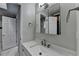 Clean bathroom with a single sink, white marble counters, and modern fixtures at 5025 Oak Bluff Ct, Atlanta, GA 30350