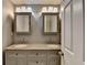 Elegant bathroom featuring a double vanity with granite countertop, offering luxury and functionality at 5025 Oak Bluff Ct, Atlanta, GA 30350
