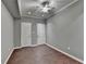 Neutral bedroom with hardwood flooring, ceiling fan and trim, and gray walls for a relaxing space at 5025 Oak Bluff Ct, Atlanta, GA 30350