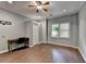 Bedroom with hardwood floors, a desk, and a bright window, offers a versatile space for work or relaxation at 5025 Oak Bluff Ct, Atlanta, GA 30350