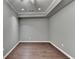 A clean, empty room features wood floors, recessed lighting, and neutral gray paint at 5025 Oak Bluff Ct, Atlanta, GA 30350