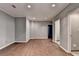 A modern bedroom with hardwood floors, recessed lights, and a serene gray color scheme at 5025 Oak Bluff Ct, Atlanta, GA 30350